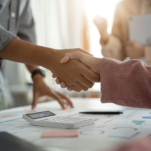 bigstock-Business-People-Shaking-Hands-456783725