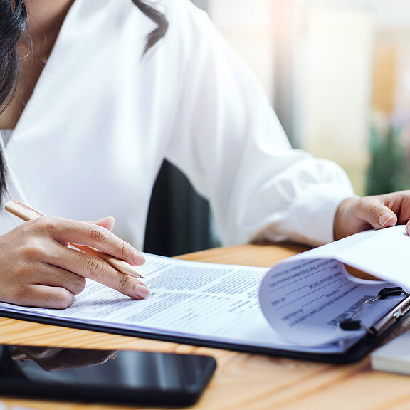 bigstock-Asian-Businesswoman-Reviewing-464833887