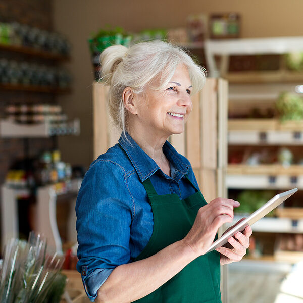 bigstock-Shop-assistant-with-digital-ta-295530130