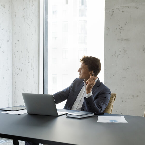 bigstock-Businessman-Looks-Out-Window-A-456680245