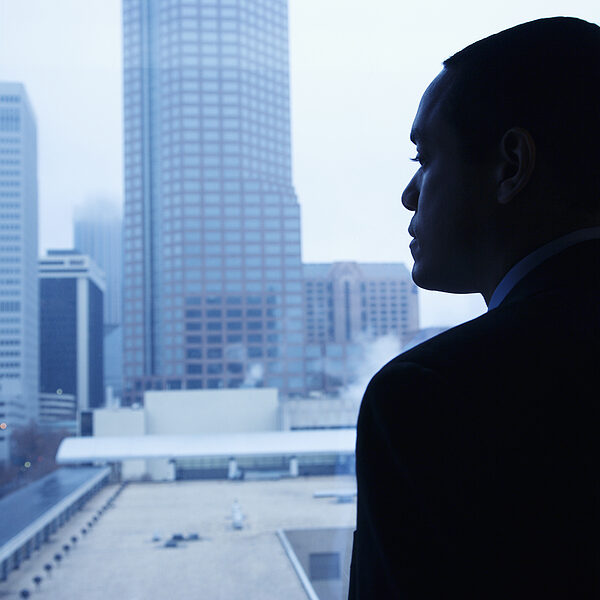 bigstock-Businessman-Looking-Through-A-6856390